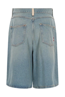 Back view of amish supplies women’s crew sand stone blue light-wash denim shorts with high waist and red logo patch