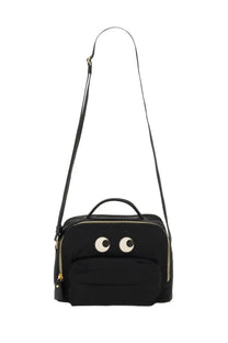 Anya Hindmarch women’s black canvas shoulder bag with playful white embroidered eyes and gold-tone zippers