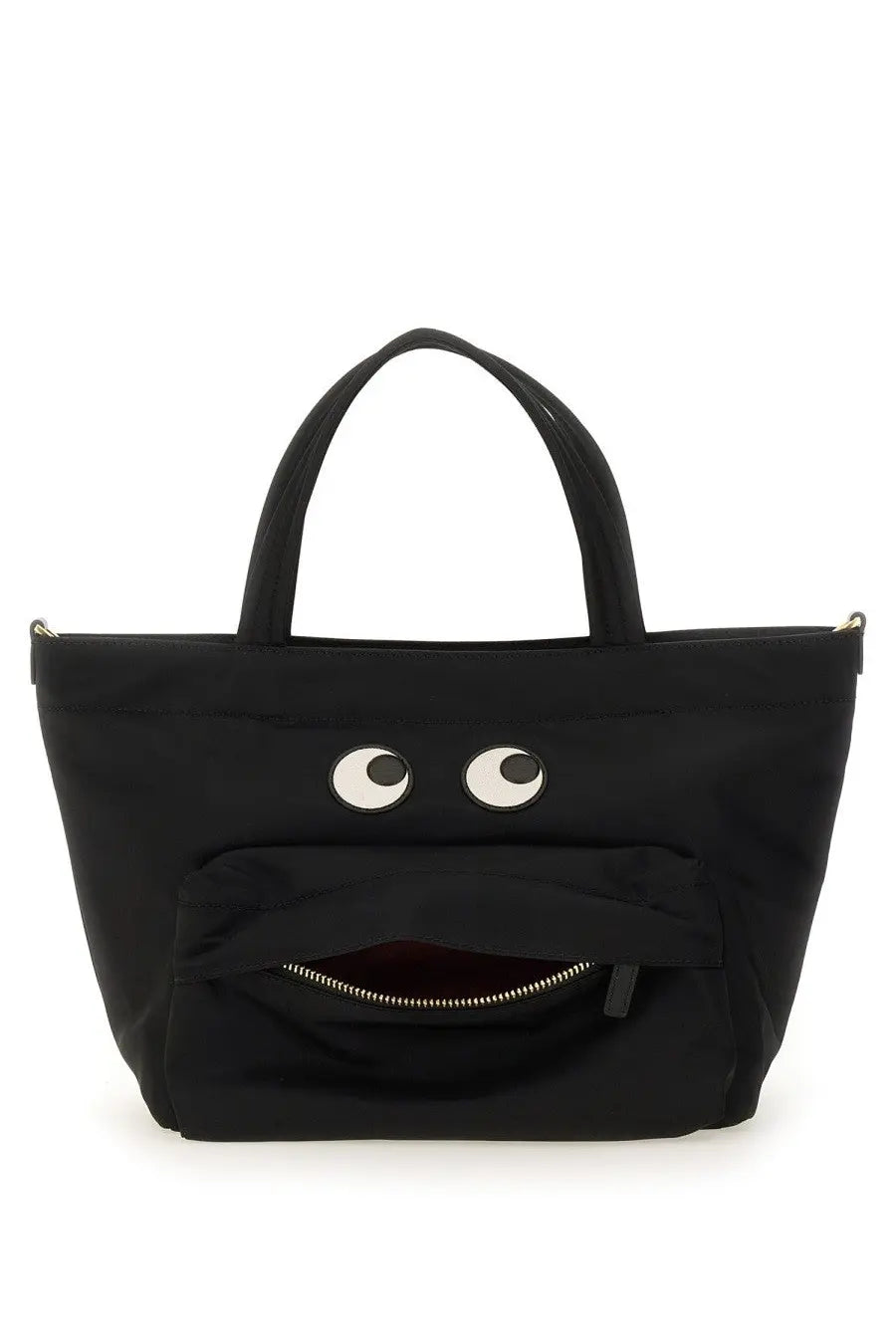 Anya Hindmarch women’s black canvas mini tote bag with playful white eyes and zipper-mouth design