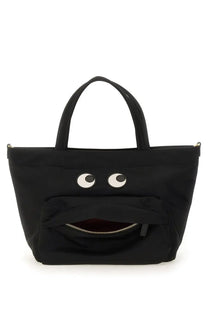 Anya Hindmarch women’s black canvas mini tote bag with playful white eyes and zipper-mouth design