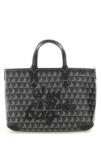 Anya Hindmarch women’s black and gray patterned plastic tote bag with embossed i am a lady text in bold cursive font