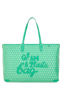 Anya Hindmarch women’s mint green tote bag with white silhouette pattern and bold raised i am a plastic bag lettering