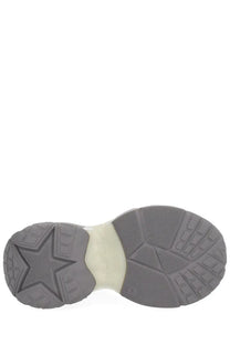 Gray rubber sole with star-shaped tread and cream midsole of ash women’s dragon sneaker grey shown from back side