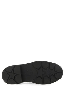 Black rubber sole with star-shaped tread pattern on the back of ash women’s medusa loafer in black