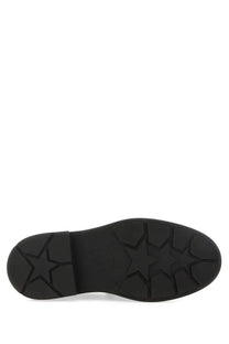 Black rubber sole with star-shaped tread pattern on ash women’s moccasin miracle black shoe back side