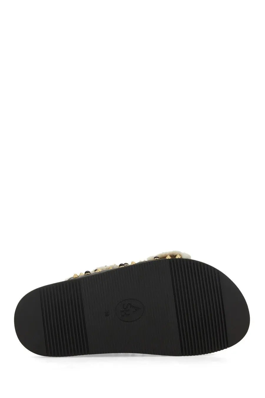 Black rubber sole of ash womens sandal utah bis black with textured grip pattern and small embossed logo in center