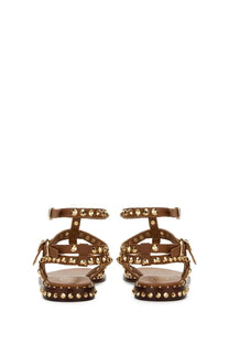 Brown leather sandals with gold-tone studs and flat platform sole from ash womens sandalo play brown collection