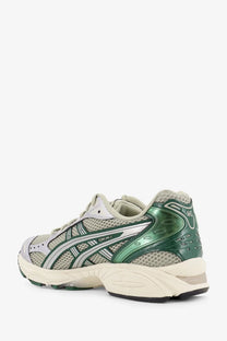 Asics men’s gel kayano 14 running shoe in green and silver with mesh upper and rubber sole for durability