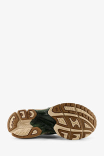 Dark green and beige rubber sole with textured geometric tread on asics men’s gel kayano mesh sneakers white