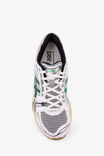 Asics men’s gel kayano mesh sneakers white with white and green mesh upper black accents and tan rubber sole