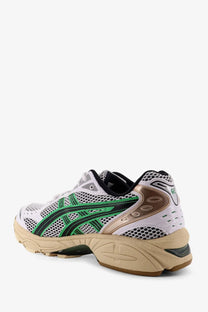 White asics men’s gel kayano mesh sneakers with breathable white mesh upper and green and bronze accents