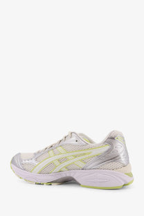 Asics men’s gel kayano mesh sneakers white with a sleek mesh upper silver and pale green accents and metallic overlays