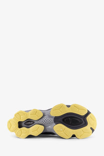 Yellow and black rubber sole with chunky sculpted design on ASICS men’s gel kinetic mesh sneakers multicolor