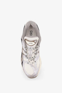 Asics men’s gel kayano 10 running shoe with white gray mesh upper black accents and silver metallic finish