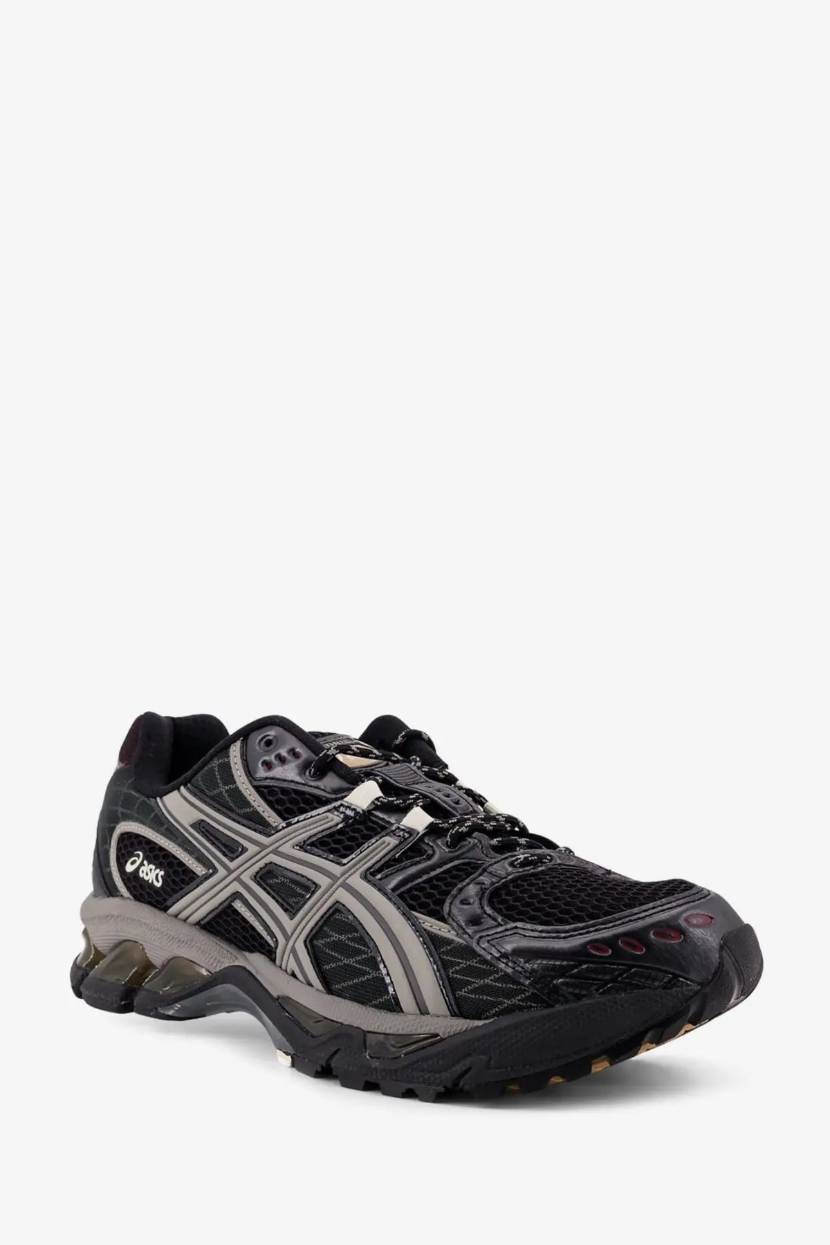 Asics men’s gel nimbus mesh sneakers in black with silver accents featuring a mesh upper and rugged rubber sole
