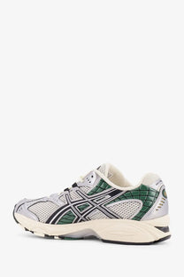 Asics men’s gel kayano 14 running shoe in silver and green with mesh synthetic overlays and white rubber sole