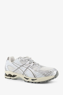 Asics men’s gel nimbus white running shoe with white silver mesh upper quilted overlays and translucent air heel unit