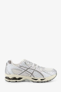Asics men’s gel nimbus running shoe in white and silver with quilted mesh upper and gel cushioning sole