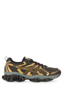 Asics men’s gel quantum kinetic sneaker in black and gold with mesh upper bold logo and chunky rubber sole