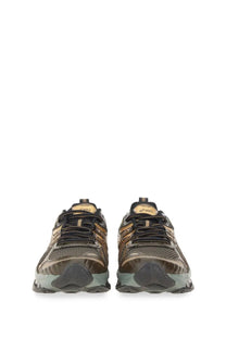 Asics men’s gel quantum kinetic sneaker in black and gold with mesh upper metallic accents and textured rubber sole