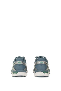 Asics unisex gel cumulus running shoes with blue and silver mesh upper white midsole and green heel accents shown from back