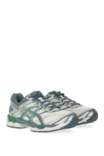 Asics unisex gel cumulus sneaker in white and teal with mesh upper rubber sole and green accents