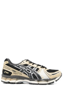 Beige and black asics unisex gel kayano sneaker with mesh upper reflective silver stripes and translucent gel sole