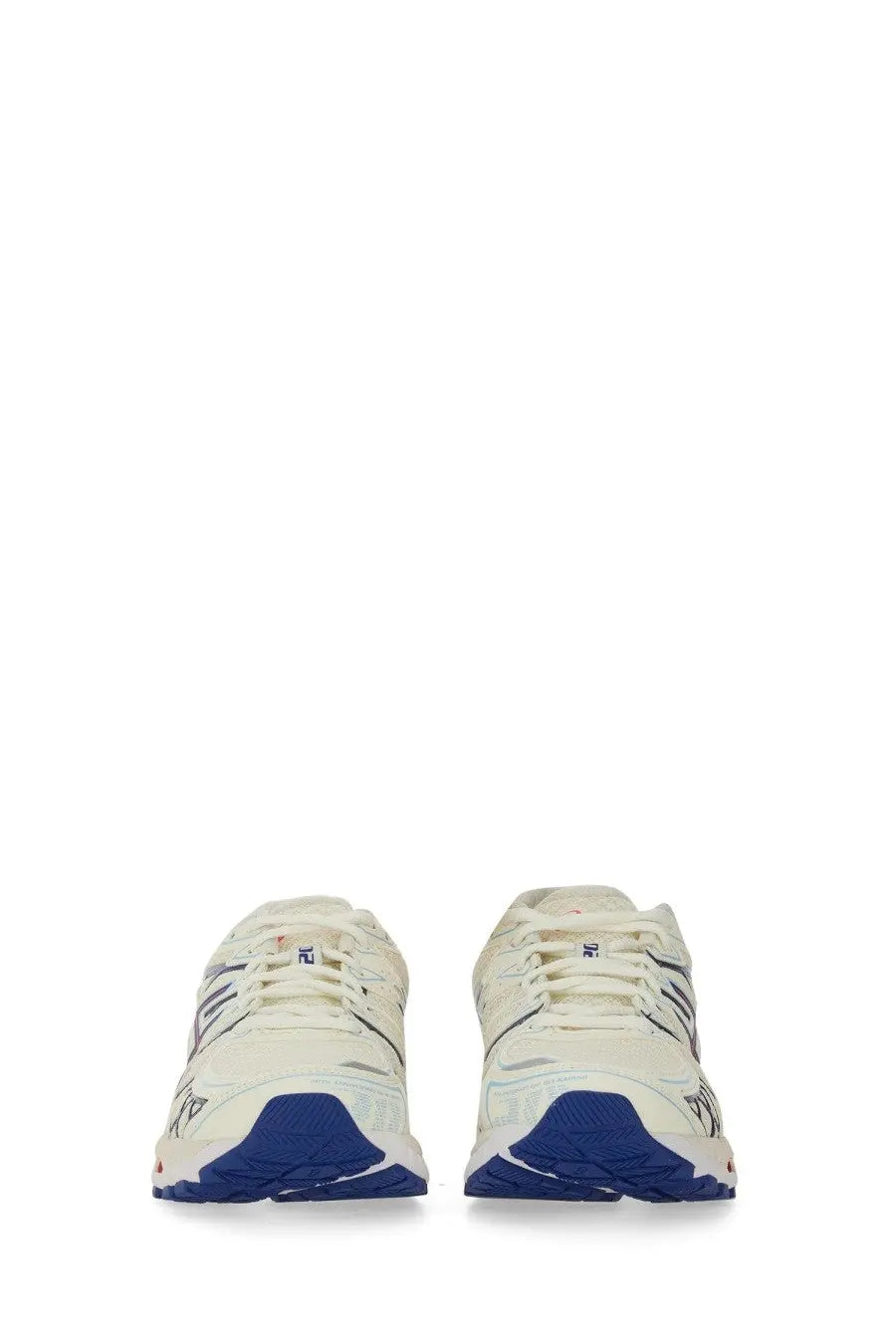 Cream-colored asics unisex gel kayano running shoes with navy blue accents and textured rubber sole front view