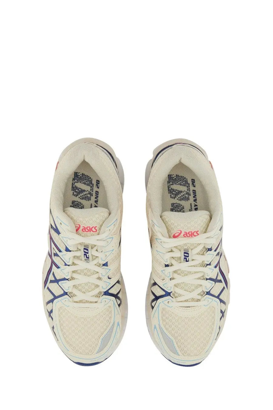 Cream-colored asics unisex gel kayano sneaker with navy and gray mesh upper featuring signature branding