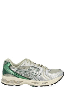 Asics unisex gel kayano sneaker with silver and green mesh upper metallic accents and cushioned sole for running
