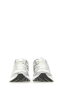 Silver and white asics unisex gel kayano sneakers with mesh panels rubber soles and a sleek modern athletic design