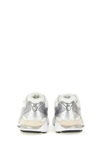Asics unisex gel kayano sneaker in silver and white with translucent midsole and gel-nimbus running shoe design