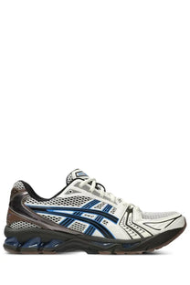White asics gel kayano unisex running shoe with mesh upper and cushioned sole in blue and black accents