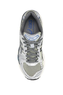 Asics unisex gel kayano running shoe in silver and gray mesh with black laces and blue branding details