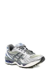 Asics unisex gel kayano sneaker silver with silver and gray mesh upper and blue accents on heel and midsole