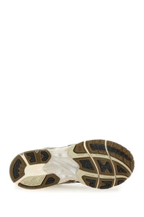 Brown and beige rubber sole with black traction patterns on asics unisex gel nimbus grey running shoe