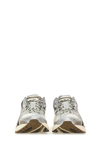 Asics unisex gel nimbus sneaker grey in silver and beige with textured mesh and synthetic overlays for athletic use