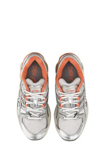 Asics unisex gel nimbus sneaker in silver and orange with mesh uppers and metallic accents for running