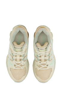 Cream-colored Asics unisex gel nimbus 23 sneakers with mesh and synthetic overlays and mint green accents