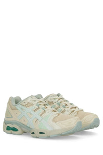 Cream and mint green Asics Gel-Kayano 27 sneakers with mesh and synthetic overlays for unisex use