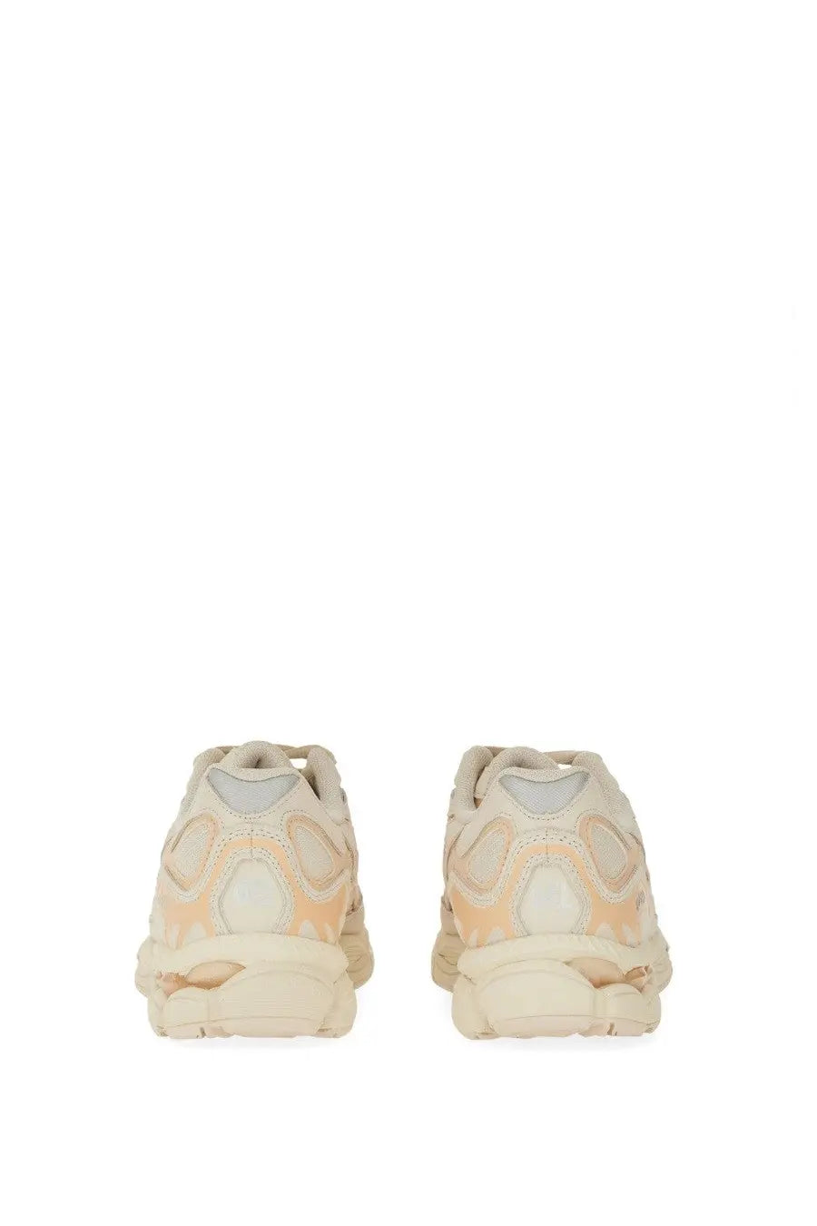 Cream-colored balenciaga triple s sneakers with chunky sculpted sole and layered mesh and rubber detailing
