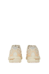 Cream-colored balenciaga triple s sneakers with chunky sculpted sole and layered mesh and rubber detailing