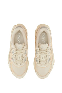 Cream-colored asics unisex gel nyc sneaker with chunky layered design and breathable mesh upper in beige