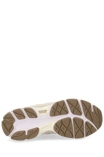 Cream-colored and tan rubber sole with textured geometric tread on asics unisex gel nyc sneaker beige