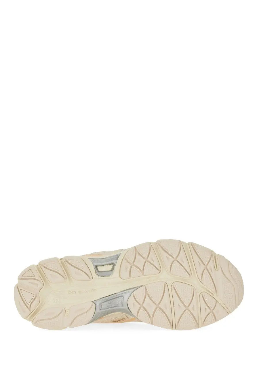 Beige and gray rubber sole with textured geometric tread pattern on asics unisex gel nyc sneaker