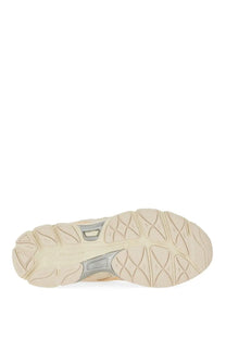 Beige and gray rubber sole with textured geometric tread pattern on asics unisex gel nyc sneaker