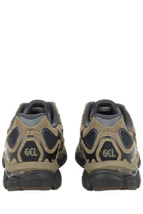 Back view of tan and black suede and mesh asics unisex gel nyc sneaker with chunky rubber sole and gcl logo on heel