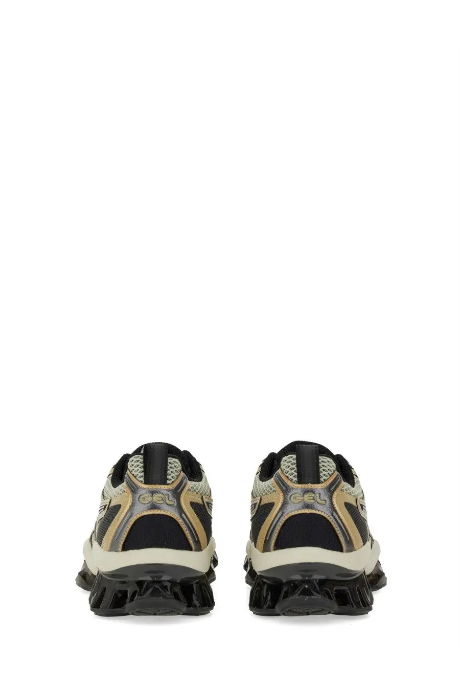 Asics unisex gel quantum kinetic sneaker in black and beige with textured mesh upper metallic gold accents and chunky sole