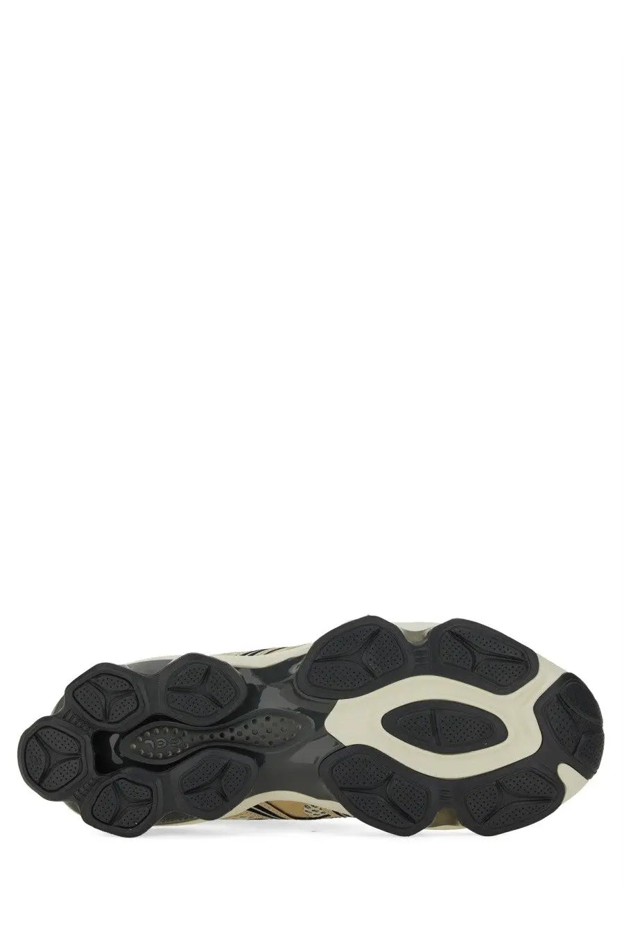 Black and beige rubber sole of asics unisex gel quantum kinetic sneaker with chunky sculpted design and oval midsole accent