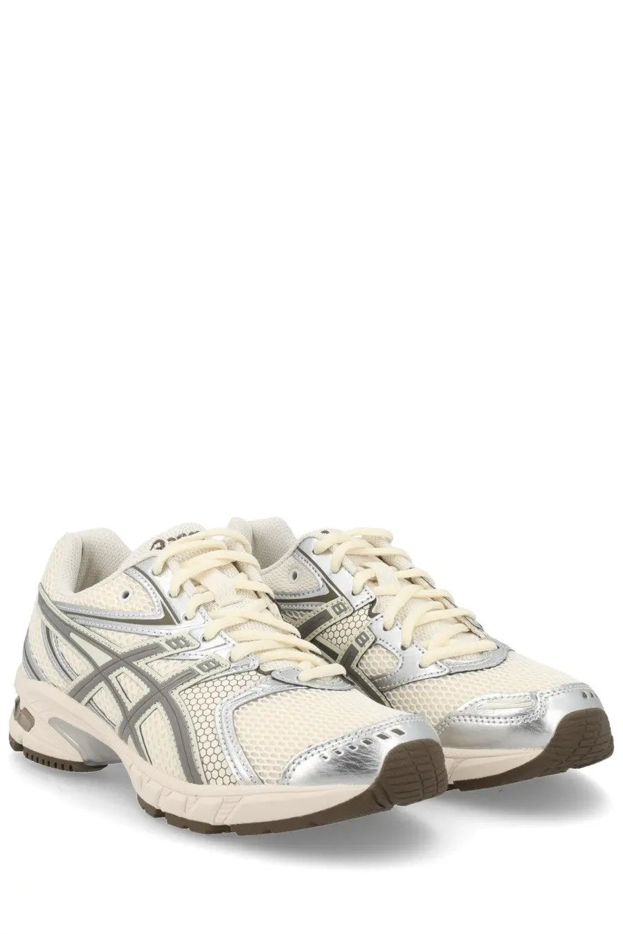 Cream-colored asics unisex sneaker gel ds trainer with silver metallic accents and breathable mesh upper